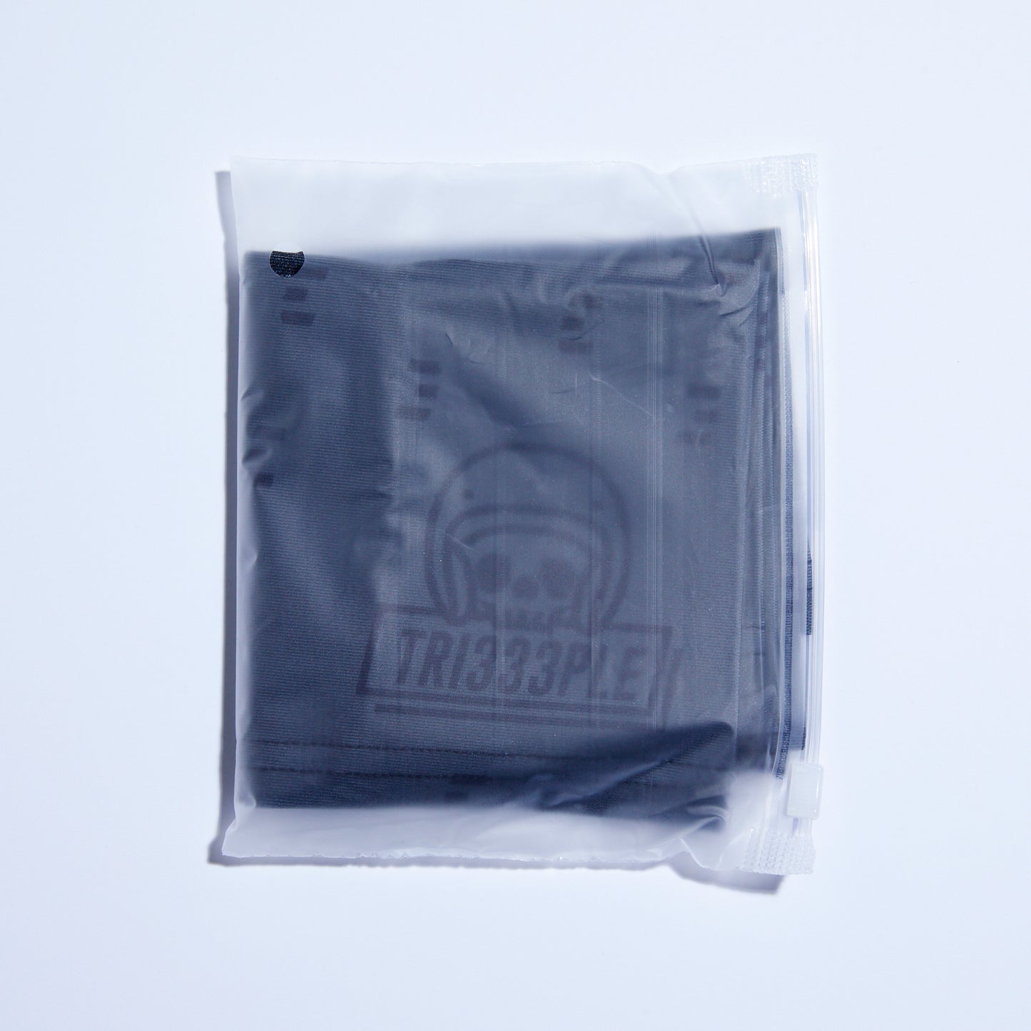 tri333ple lycra headbuff for motorcycle skully blacked out in packaging